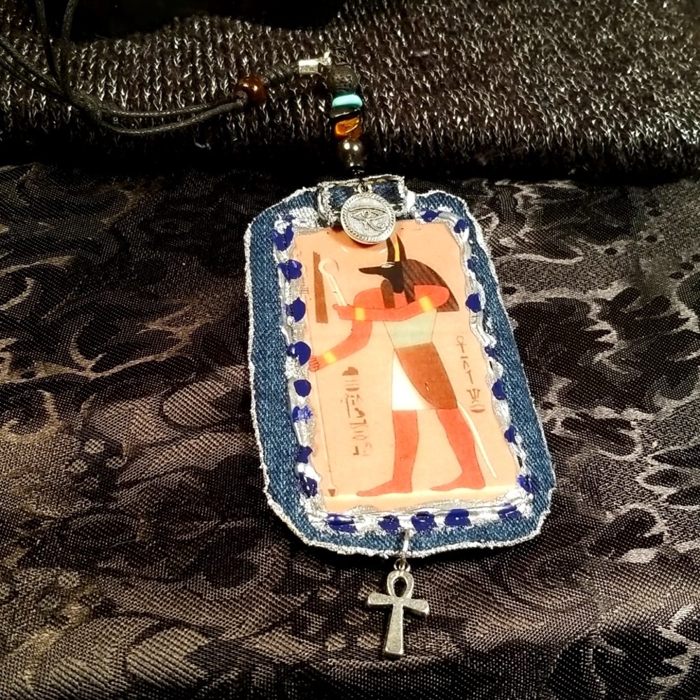 Ancient Egyptian deity Anubis mounted on denim fabric necklace